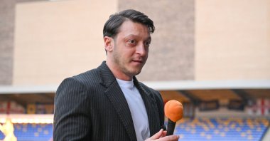 Former football player Mesut Özil, a member of the AK Party Central Decision and Executive Board (MKYK) speaks at a mass iftar program, London, U.K., March 16, 2025. (AA Photo)