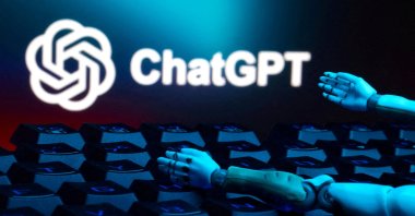 The ChatGPT logo, a keyboard and robot hands are seen in this illustration taken Jan. 27, 2025. (Reuters Photo)