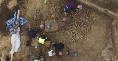 People work on the excavation of a Roman mass grave from the end of the 1st century AD, in the Simmering district of Vienna, Austria, Thursday, Nov. 7, 2024. (A. Slonek/Novetus via AP)