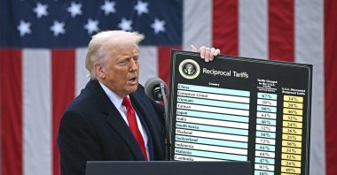 U.S. President Donald Trump holds a chart as he delivers remarks on reciprocal tariffs during an event in the Rose Garden entitled &amp;quot;Make America Wealthy Again&amp;quot; at the White House in Washington, D.C., April 2, 2025. (AFP Photo)