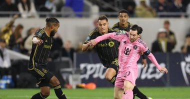 Inter Miami's Lionel Messi (R) battles for possession against LAFC players during the CONCACAF Champions Cup 2025 quarterfinal first leg match at BMO Stadium, Los Angeles, U.S., April 2, 2025. (AFP Photo)