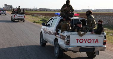 Syrian army personnel travel in a military vehicle as they head toward Latakia to join the fight against the fighters linked to Syria&#039;s ousted leader Bashar Assad, Aleppo, Syria, March 7, 2025. (REUTERS)
