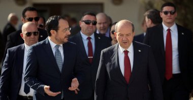 Greek Cypriot administration leader Nikos Christodoulides and Turkish Republic of Northern Cyprus (TRNC) President Ersin Tatar talk before a meeting in the U.N. buffer zone, Lefkoşa (Nicosia), TRNC, April 2, 2025.  (Reuters Photo)