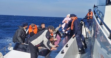 A Turkish coast guard vessel picks up a group of irregular migrants off the coast of western Çanakkale province, Türkiye, Nov. 2, 2024. (AA Photo)