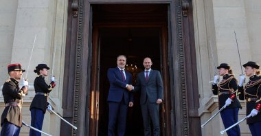 This handout photograph taken and released by the Foreign Ministry on April 2, 2025, shows Foreign Minister Hakan Fidan (L) shaking hands with French Minister for Europe and Foreign Affairs Jean-Noel Barrot ahead of their meeting during Fidan's official visit to Paris. (AFP Photo)