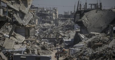 Internally displaced Palestinians walk past the rubble of destroyed buildings in the Jabalia refugee camp, northern Gaza Strip, April 3, 2025. (EPA Photo)