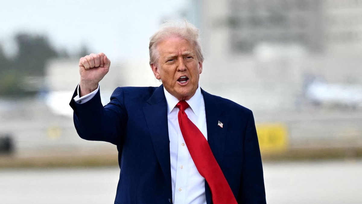 U.S. President Donald Trump pumps his fist upon arrival at Miami International Airport, Miami, U.S., April 3, 2025. (AFP Photo)
