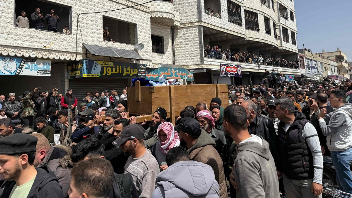 Mourners carry the casket of one of several people killed in reported Israeli shelling on Nawa, Daraa, southern Syria, April 3, 2025. (AFP Photo)