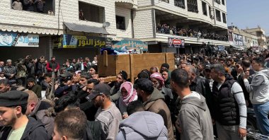 Mourners carry the casket of one of several people killed in reported Israeli shelling on Nawa, Daraa, southern Syria, April 3, 2025. (AFP Photo)