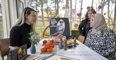A young girl listens attentively to an elderly lady sharing her life story, Istanbul, Türkiye, March 11, 2025. (AA Photo)