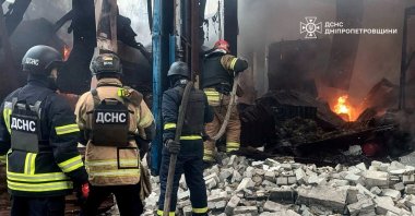 Firefighters work to extinguish a fire at the site of a Russian missile strike in Kryvyi Rih, Ukraine, April 2, 2025. (Press service of the State Emergency Service of Ukraine in Dnipropetrovsk region/Handout via Reuters)