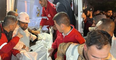 Paramedics transport out of an ambulance some of the bodies of Palestinian first responders, who were killed a week before in Israeli military fire on ambulances, into Nasser Medical Complex, Khan Younis, Gaza Strip, Palestine, March 30, 2025. (AFP Photo)