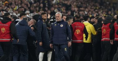 Fenerbahçe coach Jose Mourinho (L) reacts as players clash during the Turkish Cup quarterfinal match against Galatasaray at the Ülker Stadium, Istanbul, Türkiye, April 2, 2025. (IHA Photo)
