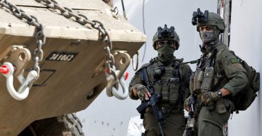 Israeli soldiers stand next to a military vehicle during an Israeli raid, Jenin, Palestine, March 4, 2025. (Reuters Photo)