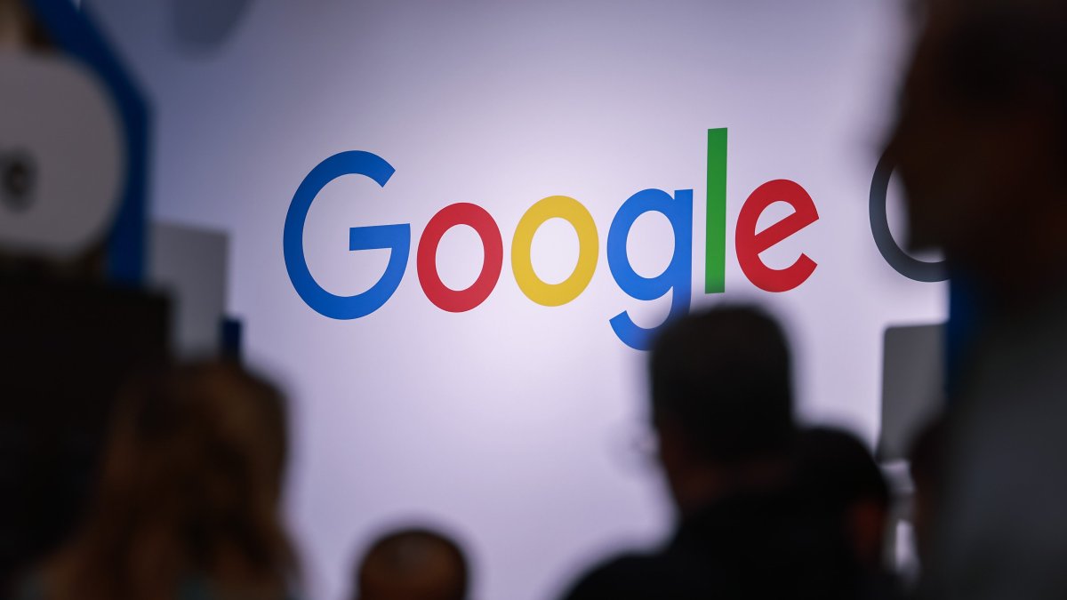 People walk past the logo of Google during the Hanover Fair 2025, Hanover, Germany, March 31, 2025. (EPA Photo)