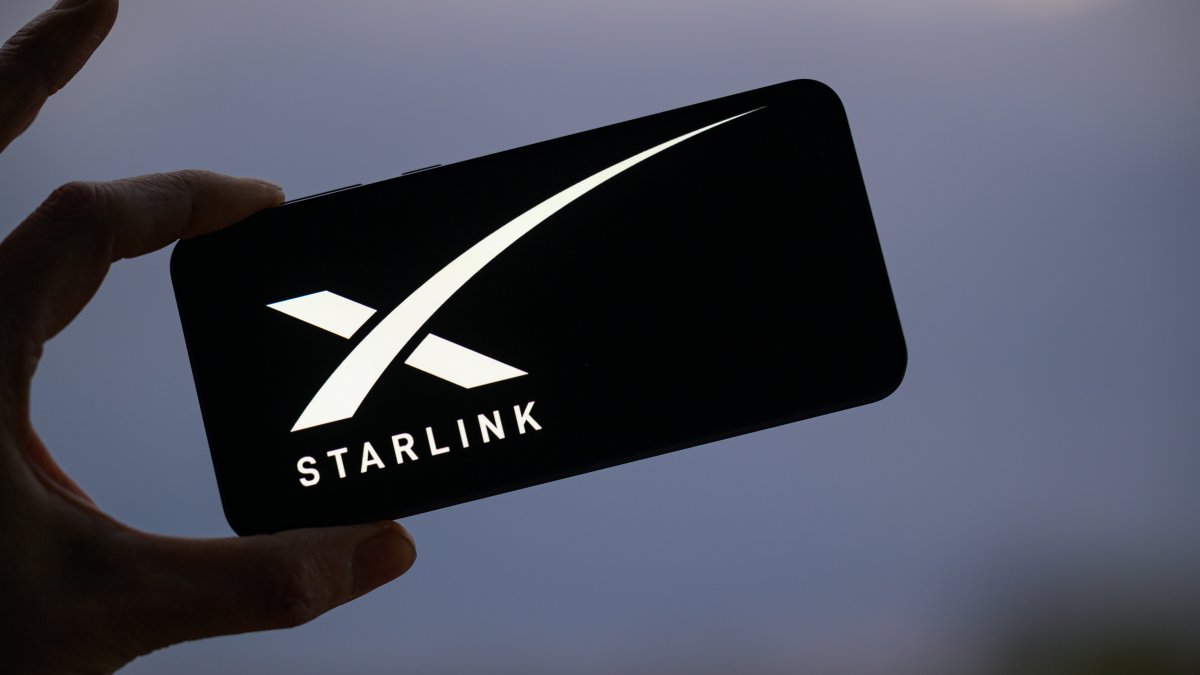 The Starlink logo is displayed on a mobile phone in this photo illustration, Brussels, Belgium, March 23, 2025. (Reuters Photo)