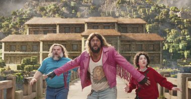 This image released by Warner Bros. Pictures shows (from L) Jack Black, Jason Momoa and Sebastian Hansen in a scene from &quot;A Minecraft Movie.&quot; (AP Photo)