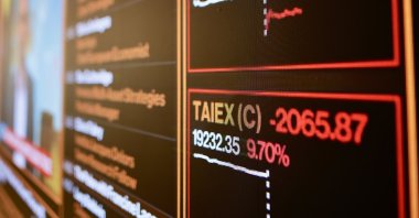A screen displays stock values inside the Taiwan Stock Exchange Office in Taipei, Taiwan, April 7, 2025. (EPA Photo)
