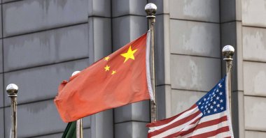 Chinese and U.S. flags are seen among others in the SMIC factory, Shanghai, China, Sept. 7, 2020. (EPA Photo)
