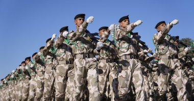 Iraqi soldiers march during an Army Day event in Baghdad, Iraq, Jan. 6, 2024. (AP Photo) 