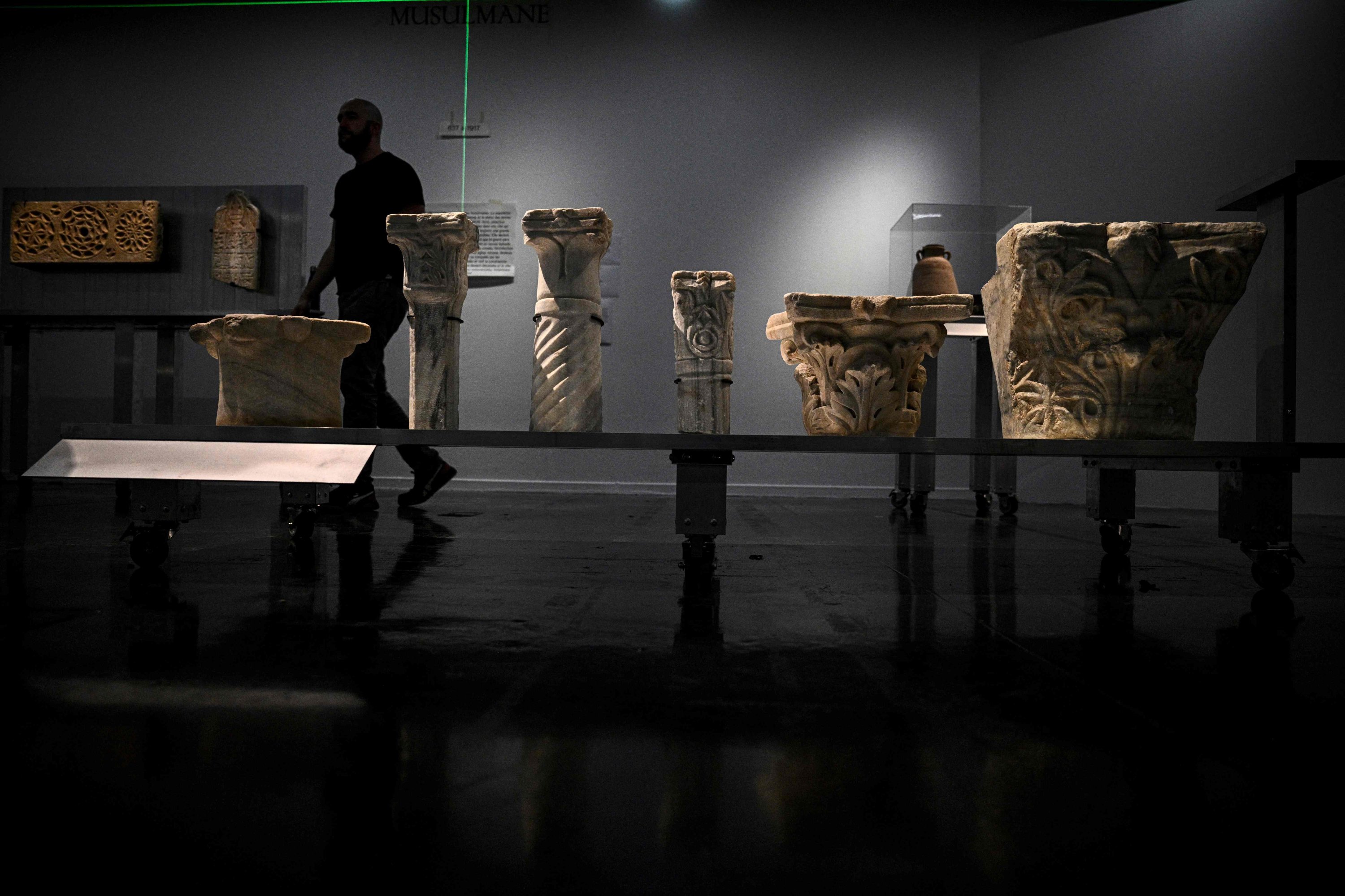 A man walks among the antiques during the archaeological heritage exhibition