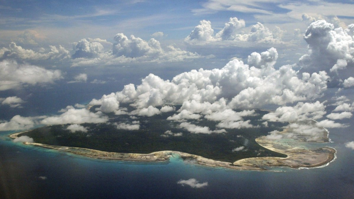 Clouds hang over the North Sentinel Island, in India&#039;s southeastern Andaman and Nicobar Islands, Nov. 14, 2005. (AP Photo)