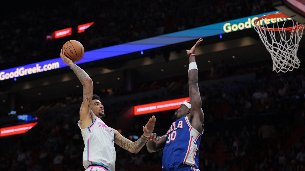 Miami Heat&#039;s Kel&#039;el Ware (L) shoots the basketball over Philadelphia 76ers&#039; Adem Bona during the second quarter at Kaseya Center, Miami, U.S., April 7, 2025