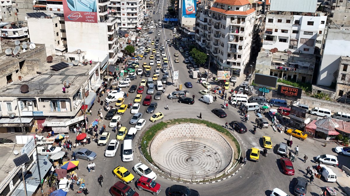 A drone view shows traffic passing by residential buildings in Latakia, Syria March 11, 2025. (Reuters File Photo)