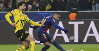 Barcelona's Raphinha scores the opening goal during the Champions League opening phase match against Borussia Dortmund at the Signal-Iduna Park, Dortmund, Germany, Dec. 11, 2024. (AP Photo)