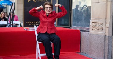 Sports icon Billie Jean King flexes her muscles during the Hollywood Walk of Fame star ceremony honoring King, Los Angeles, California, U.S., April 7, 2025. (EPA Photo)