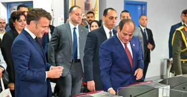 A handout photo made available by the Egyptian Presidency shows Egyptian President Abdel-Fattah el-Sissi (R) and French President Emmanuel Macron (L) visiting Adly Mansour Metro station to ride a line operated by France&#039;s RATP group during Macron&#039;s official visit to Egypt, Cairo, Egypt, April 7, 2025. (EPA Photo)