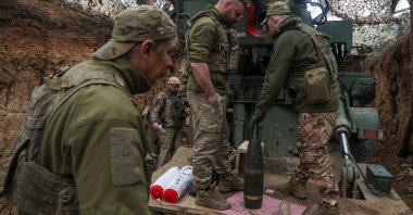 Ukrainian servicemen prepare a shell as they fire at Russian troops near Toretsk, Donetsk, Ukraine, April 7, 2025. (Reuters Photo)