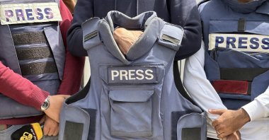Journalists gather in front of Nasser Hospital to protest the targeting of their colleagues, Helmi Al-Faqawi and Yousef Al-Khazindar, who were killed in Israeli attacks on the Gaza Strip, Khan Younis, Palestine, April 7, 2025. (AA Photo)