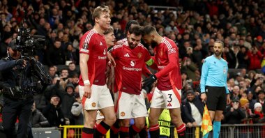 Manchester United&#039;s Bruno Fernandes (C) celebrates with teammates after scoring his third goal during the UEFA Europa League round of 16, 2nd leg match against Real Sociedad, Manchester, U.K., March 13, 2025. (EPA Photo)