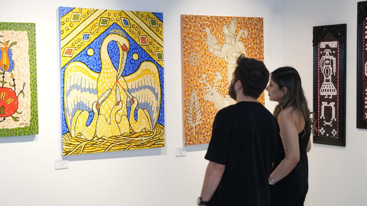 Visitors explore the "Traces of History" exhibition at the 6th Daire Art Gallery, Istanbul, Türkiye, April 9, 2025. (AA Photo)