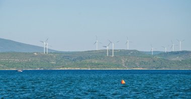 Wind turbines are seen in Sığacık, a seaside neighborhood of Seferihisar district in the western province of Izmir, Türkiye, Dec. 14, 2020. (Shutterstock Photo)