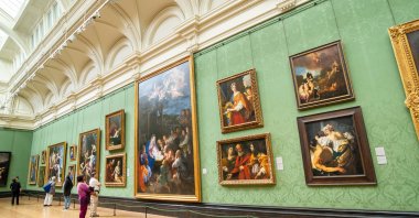 People exploring classic old master oil paintings at the National Gallery in London, U.K., June 11, 2018. (Shutterstock Photo)