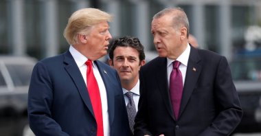 U.S. President Donald Trump and President Recep Tayyip Erdoğan gesture as they talk at the start of the NATO summit in Brussels, Belgium, July 11, 2018. (Reuters File Photo)