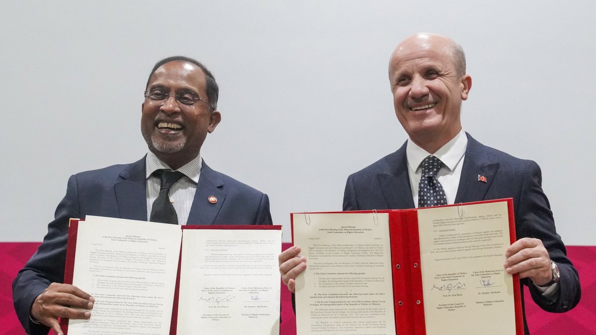Council of Higher Education President Professor Erol Özvar (R) and Malaysian Minister of Higher Education Zambry Abdul Kadir hold copies of the signed Joint Commission Meeting agreement, Istanbul, Türkiye, April 8, 2025. (Courtesy of Minister Zambry Abdul Kadir)