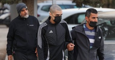 Palestinian Ahmed Manasra (C), released earlier in the day from an Israeli jail, leaves an Israeli security office accompanied by his father (R), East Jerusalem, occupied Palestine, April 10, 2025. (AFP Photo)