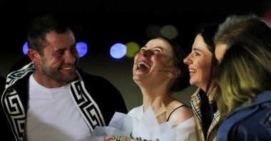 Ksenia Karelina, a Russian American dual citizen who was released from detention in Russia, reacts as she arrives at Joint Base Andrews, Maryland, U.S., April 10, 2025. (Reuters Photo)