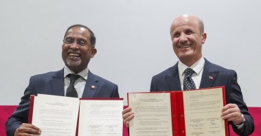 Council of Higher Education President Professor Erol Özvar (R) and Malaysian Minister of Higher Education Zambry Abdul Kadir hold copies of the signed Joint Commission Meeting agreement, Istanbul, Türkiye, April 8, 2025. (Courtesy of Minister Zambry Abdul Kadir)