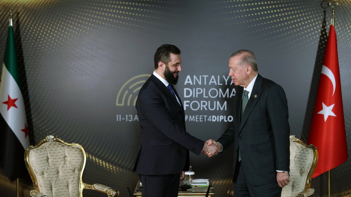President Recep Tayyip Erdoğan (R) and Syria&#039;s interim President Ahmed al-Sharaa shake hands during a meeting at the 4th edition of the Antalya Diplomacy Forum (ADF2025), Antalya, April 11, 2025. (AA Photo)