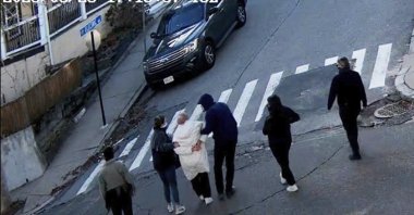 In this image taken from security camera video, Rümeysa Öztürk, a 30-year-old doctoral student at Tufts University, is detained by Department of Homeland Security agents on a street in Sommerville, Mass., U.S., March 25, 2025. (AP Photo)
