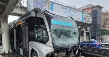 One of the Metrobuses involved in the accident is seen as officials investigate the scene, Istanbul, Türkiye, April 12, 2025. (AA Photo)