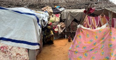 A displaced Sudanese woman rests inside a shelter at Zamzam camp, North Darfur, Sudan, Aug. 1, 2024. (Reuters Photo)