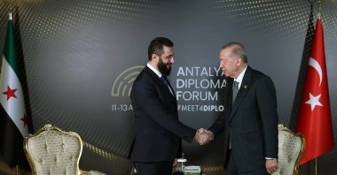President Recep Tayyip Erdoğan (R) and Syria's interim President Ahmed al-Sharaa shake hands during a meeting at the 4th edition of the Antalya Diplomacy Forum (ADF2025), Antalya, April 11, 2025. (AA Photo)