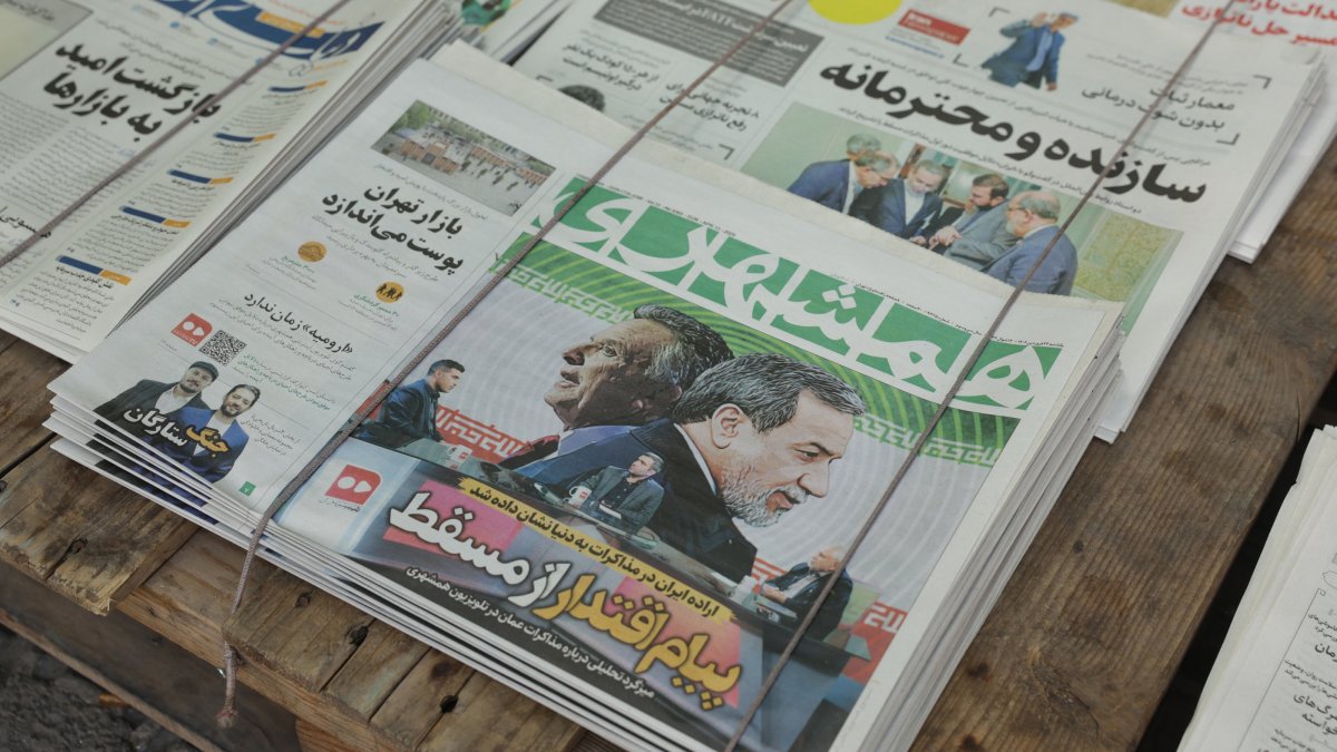A copy of Iranian daily newspaper Hamshahri entitled "Message of power from Muscat" carrying a picture of Iranian Foreign Minister Abbas Araghchi and U.S. Special Envoy to the Middle East Steve Witkoff, in a kiosk in Tehran, Iran, April 13, 2025. (EPA Photo)