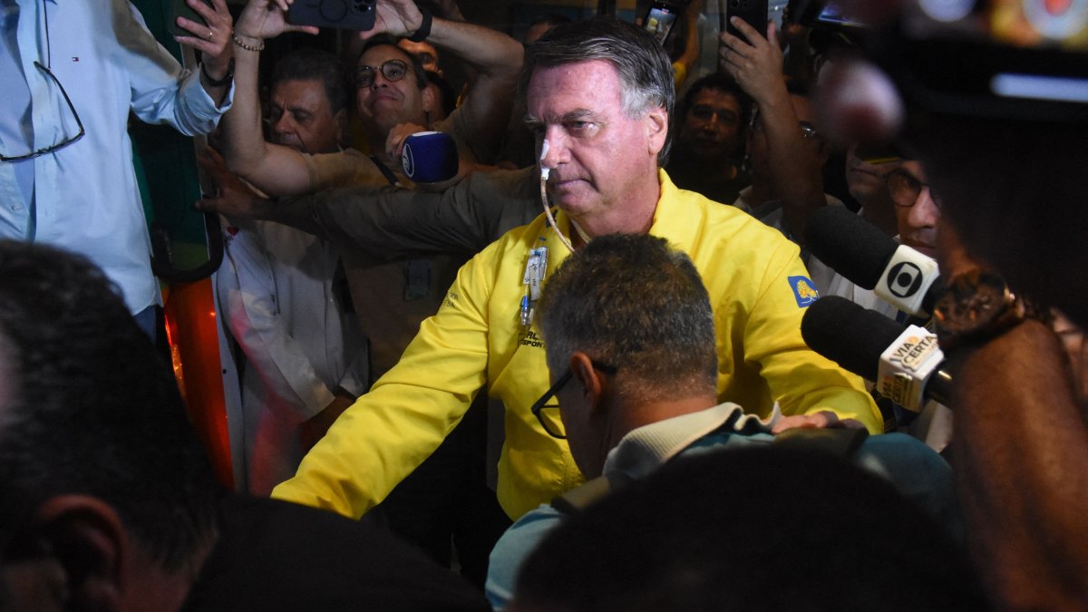 Former Brazilian President Jair Bolsonaro is pictured before boarding an ambulance as he leaves Rio Grande Hospital in Natal, Rio Grande do Norte state, Brazil, April 12, 2025. (AFP Photo)