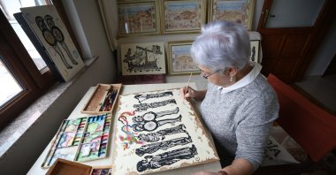 Göksel Sevim shows her artwork at her workshop in Çanakkale, northwestern Türkiye, April 12, 2025. (AA Photo)